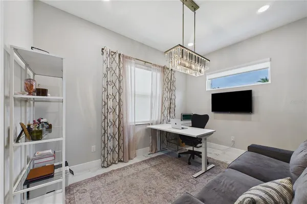 a bathroom with a granite countertop sink and a toilet