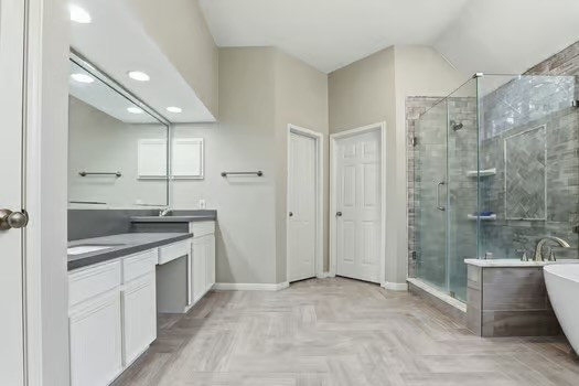 108 Inverness Conroe, TX 77356 - Photo 16 of 29 a spacious bathroom with a granite countertop sink a toilet and shower