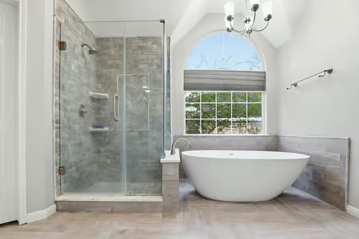 108 Inverness Conroe, TX 77356 - Photo 20 of 29 a bathroom with a bathtub and shower