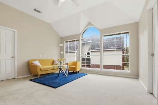 108 Inverness Conroe, TX 77356 - Photo 23 of 29 a living room with furniture and a floor to ceiling window