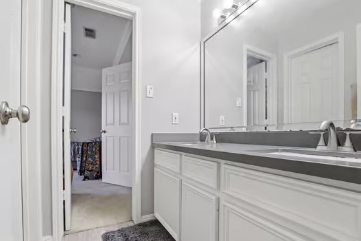 108 Inverness Conroe, TX 77356 - Photo 25 of 29 a bathroom with a double vanity sink and mirror