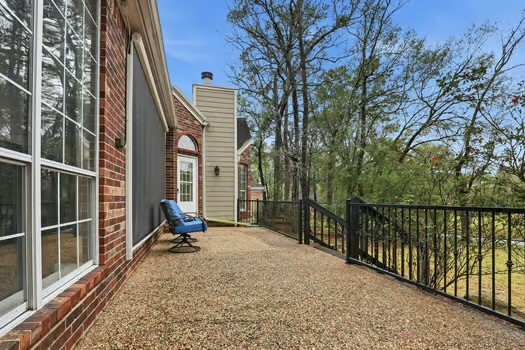108 Inverness Conroe, TX 77356 - Photo 27 of 29 a view of a balcony with a backyard
