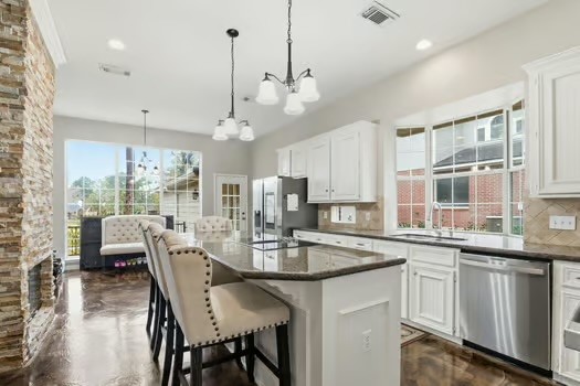 108 Inverness Conroe, TX 77356 - Photo 10 of 29 a view of a dining room and livingroom with furniture wooden floor a chandelier