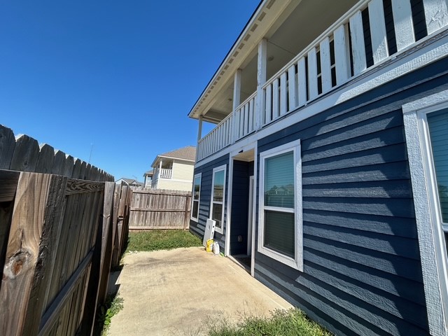 6942 Halter Loop College Station, TX 77845 - Photo 25 of 28 View of property exterior with a balcony