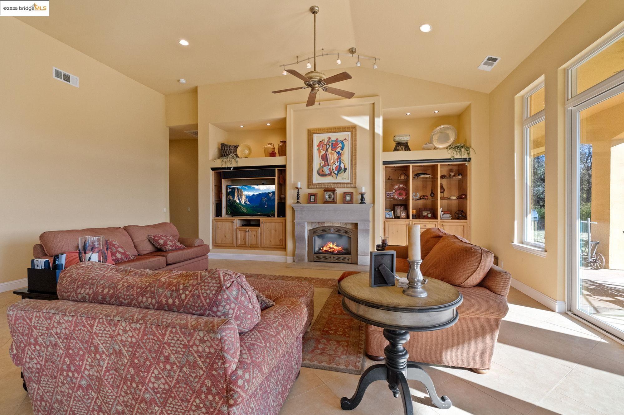 21190 Lyons Bald Mountain Road Sonora, CA 95370 - Photo 13 of 49 a living room with furniture and a fireplace