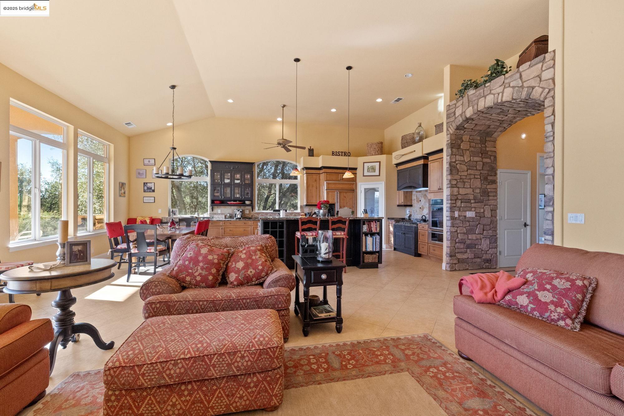 21190 Lyons Bald Mountain Road Sonora, CA 95370 - Photo 16 of 49 a living room with furniture and a large window