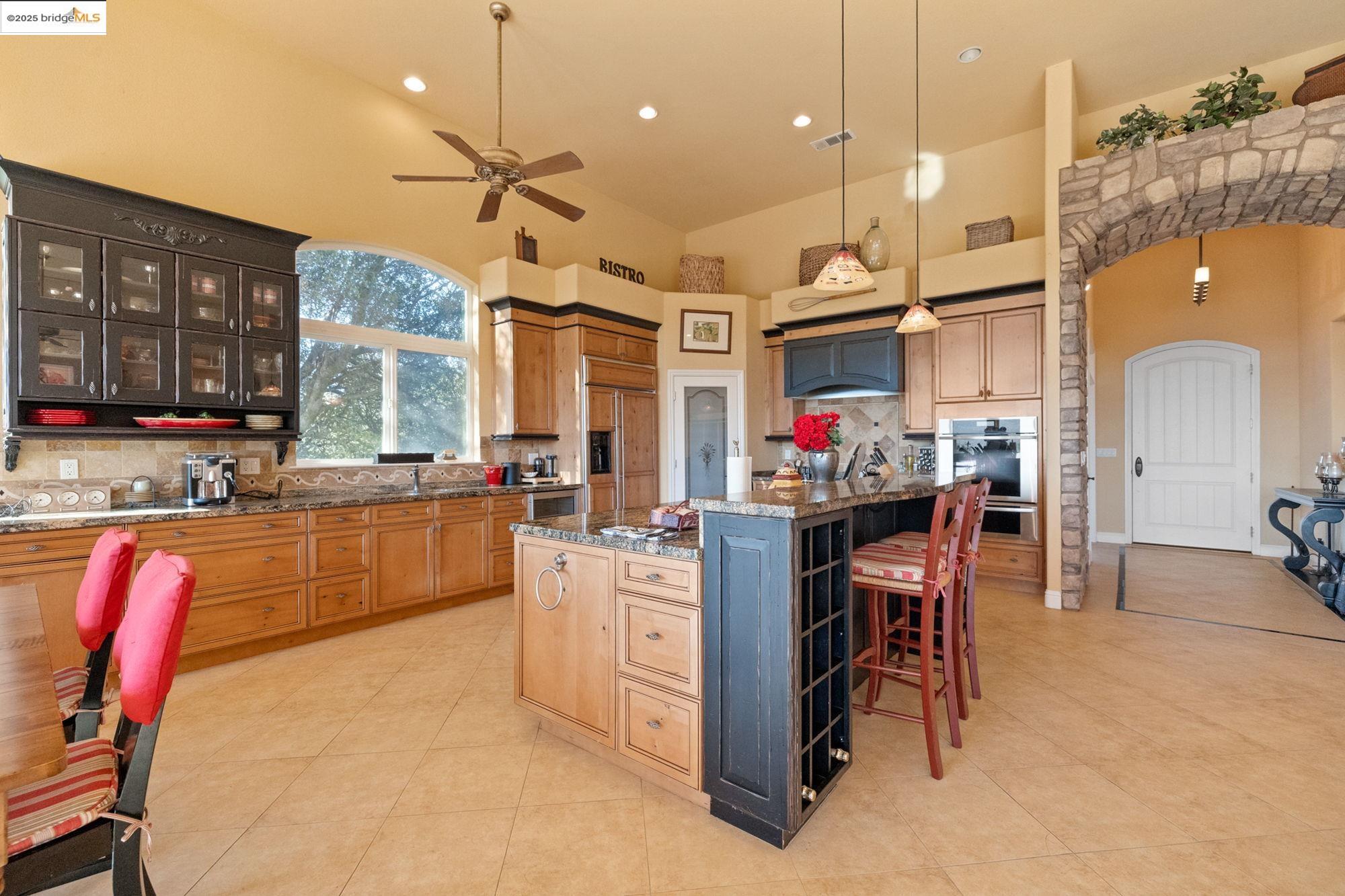21190 Lyons Bald Mountain Road Sonora, CA 95370 - Photo 17 of 49 a living room with stainless steel appliances kitchen island granite countertop furniture and a view of kitchen