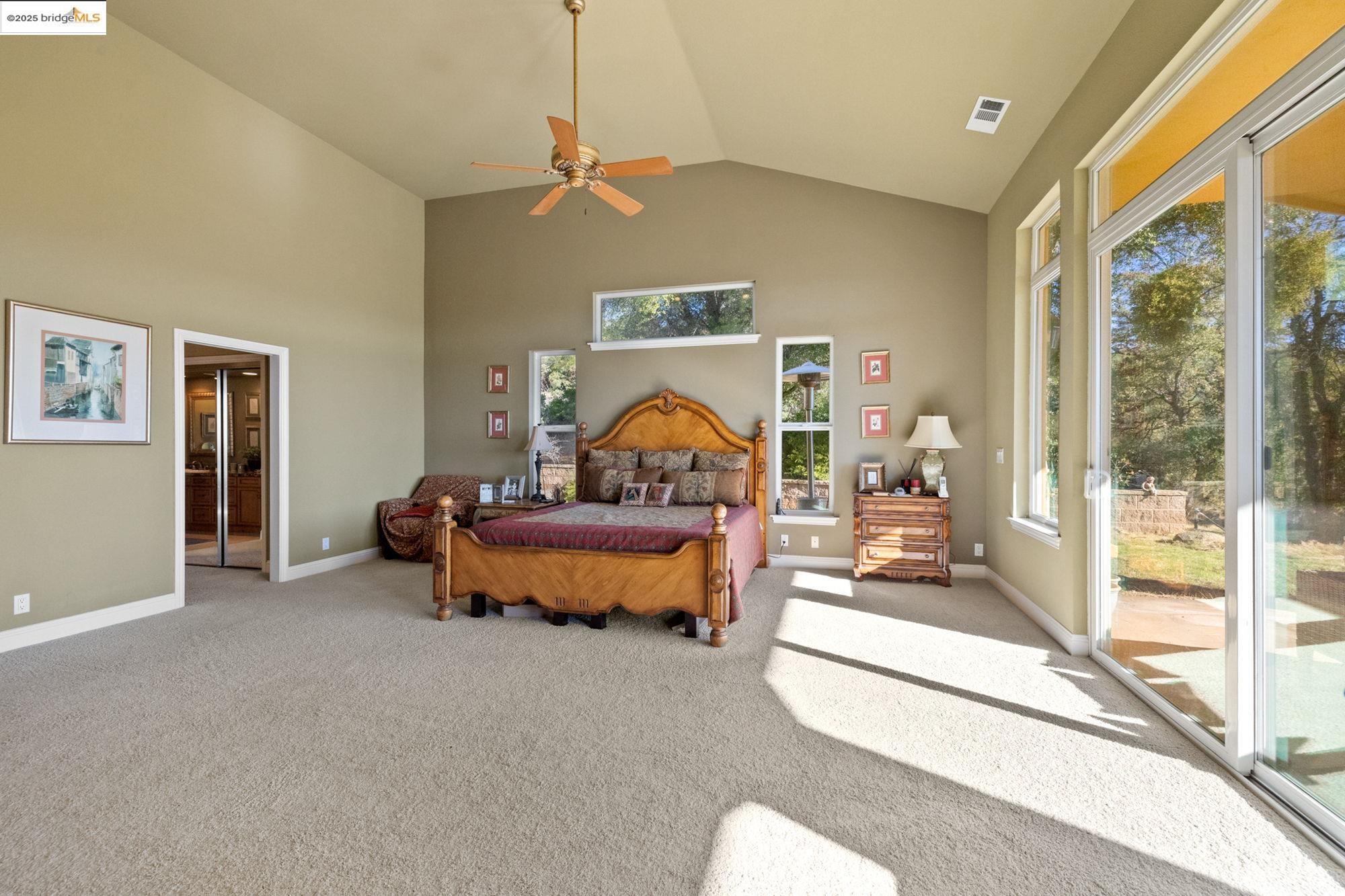 21190 Lyons Bald Mountain Road Sonora, CA 95370 - Photo 20 of 49 a bedroom with bed and a large window