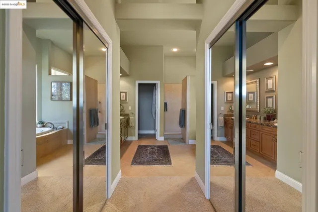 a bathroom with double sink and a mirror