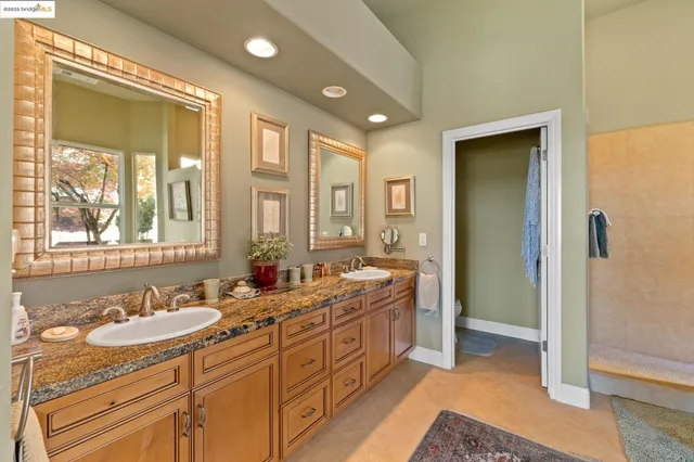 a bathroom with bathtub and window