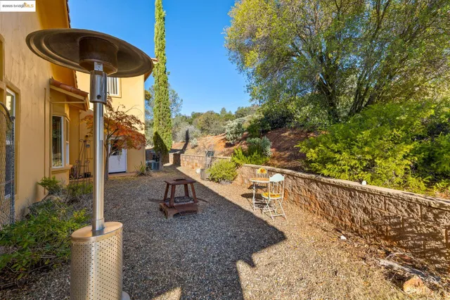 a view of a terrace with a table and chairs