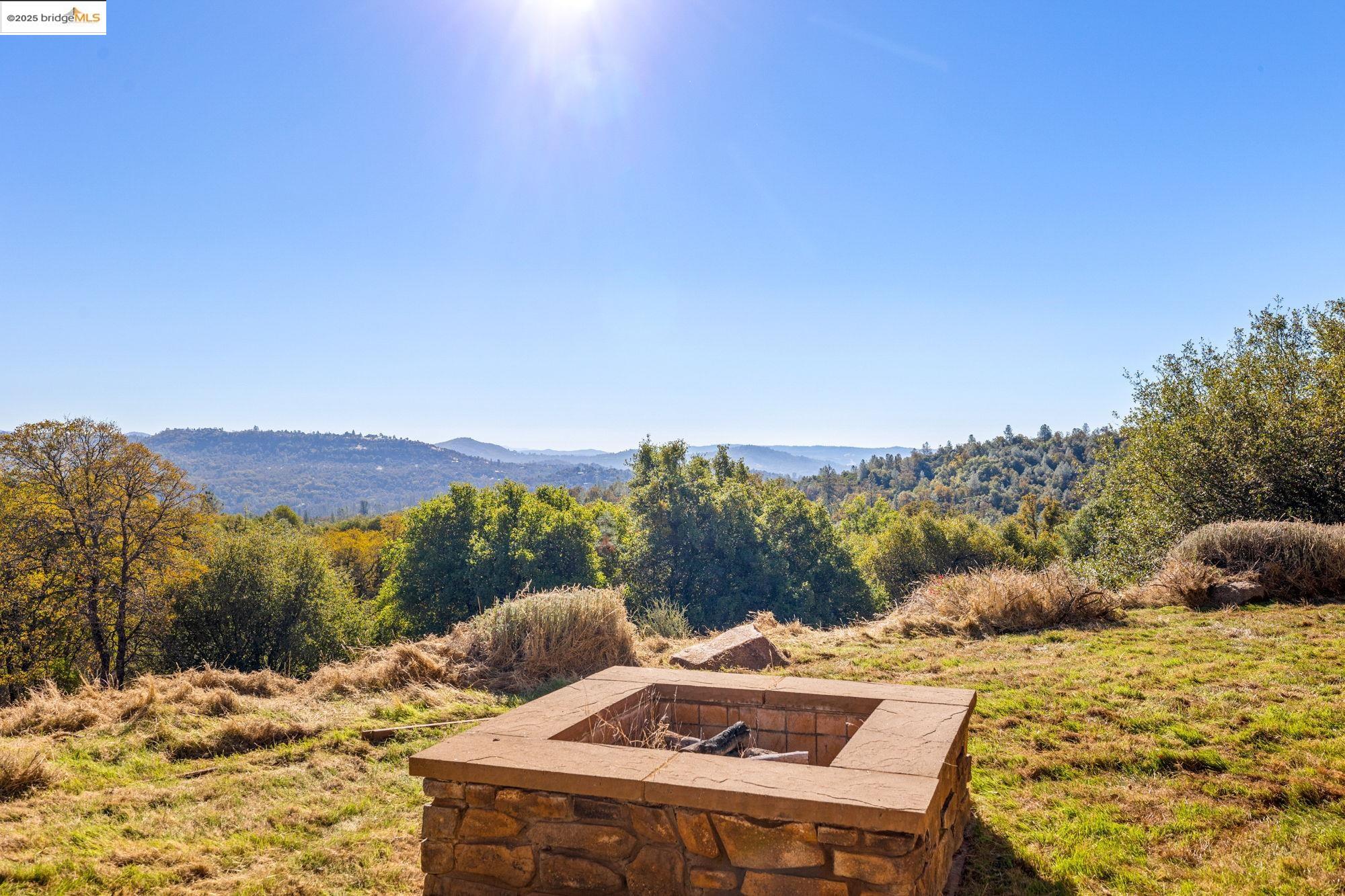 21190 Lyons Bald Mountain Road Sonora, CA 95370 - Photo 39 of 49 a view of a terrace with a table and chairs