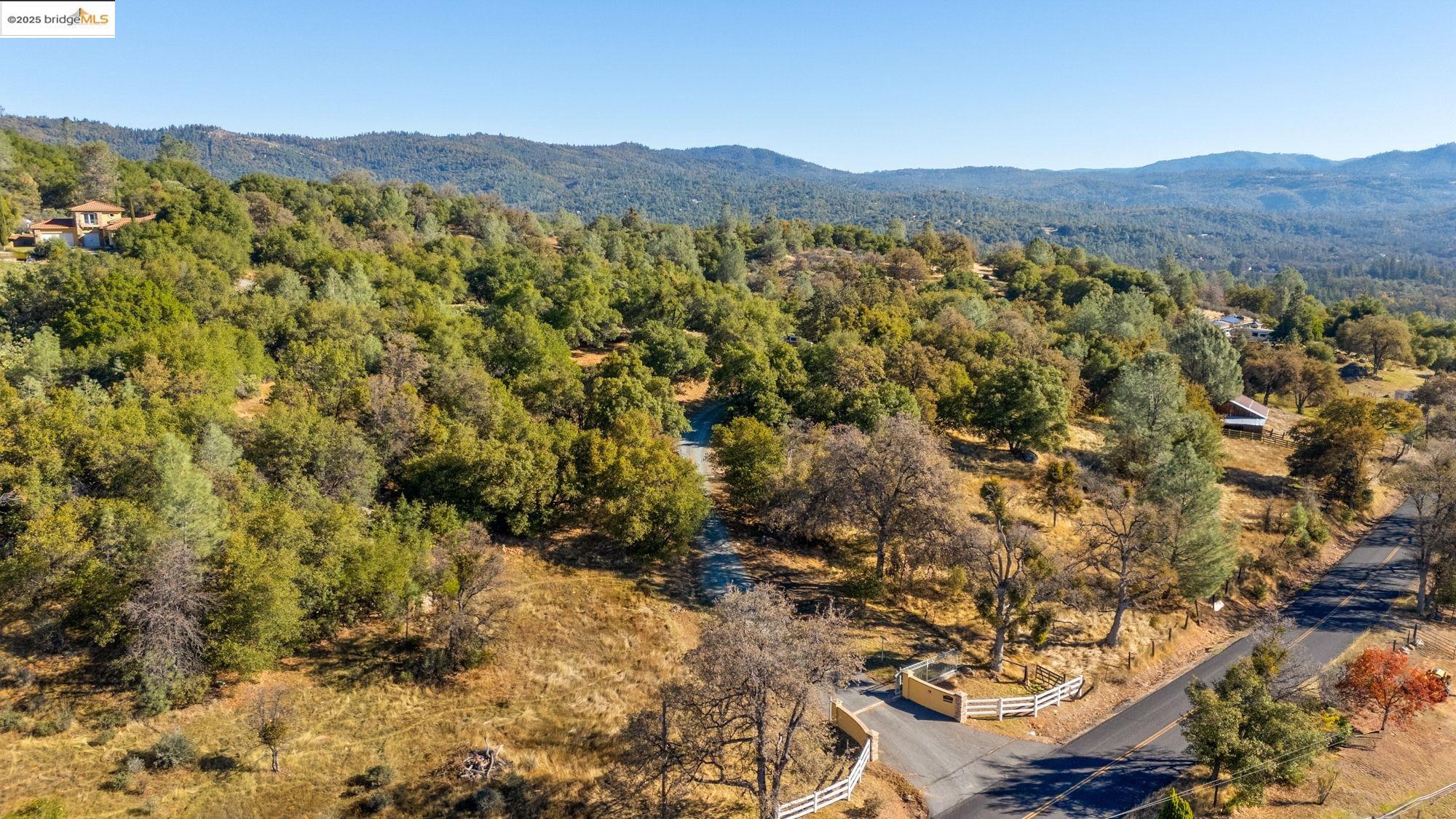 21190 Lyons Bald Mountain Road Sonora, CA 95370 - Photo 45 of 49 a view of a lush green hillside and houses