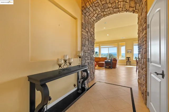 a view of a dining area with furniture and a chandelier