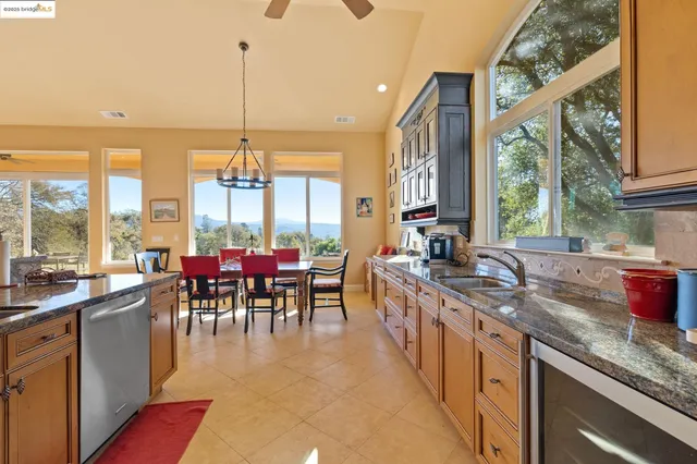a view of a dining room with furniture and window
