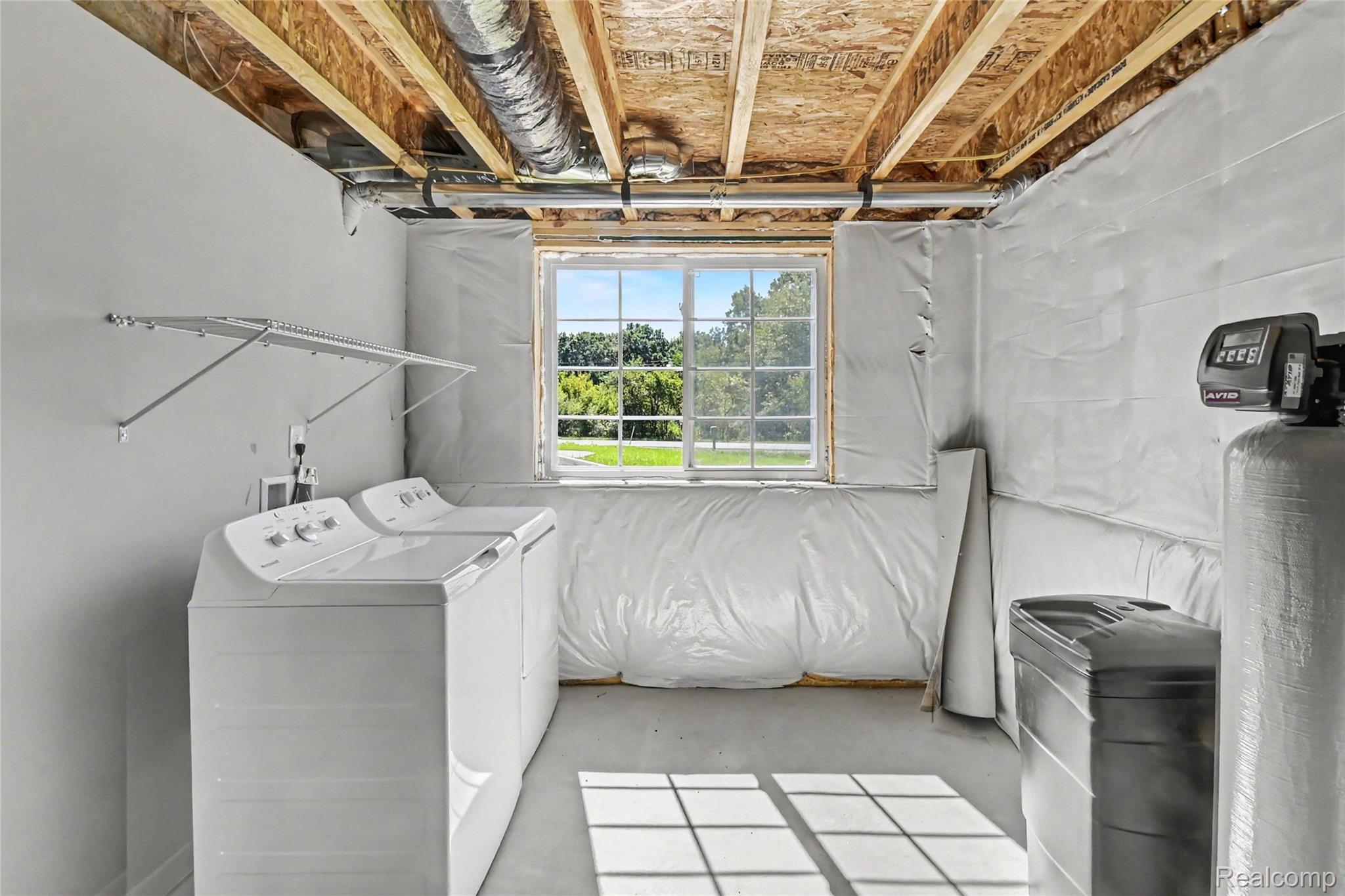 5528 Lahring Road Linden, MI 48451 - Photo 17 of 39 Utility room provides ample storage and washer & dryer are included