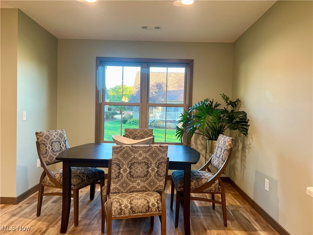 5531 Innkeeper Street Southeast Dennison, OH 44621 - Photo 16 of 30 Dining space featuring hardwood / wood-style flooring