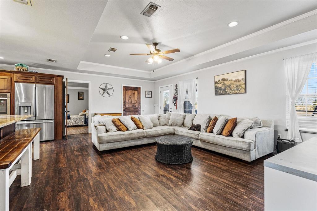 625 County Road Paris, TX 75462 - Photo 10 of 31 a living room with fireplace furniture and a wooden floor
