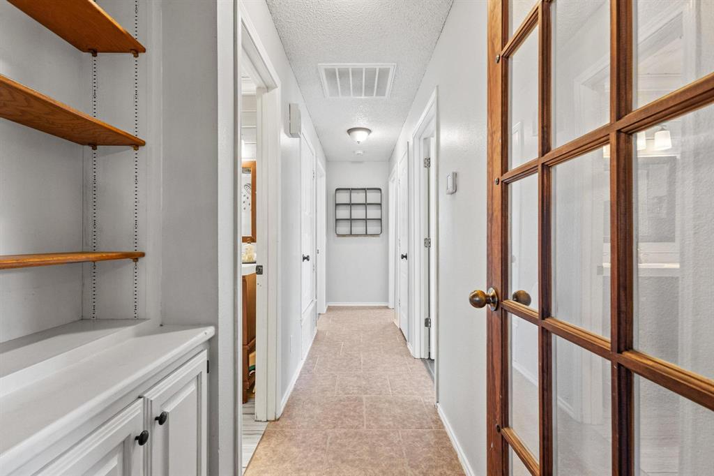 625 County Road Paris, TX 75462 - Photo 11 of 31 a view of a hallway with wooden floor and staircase