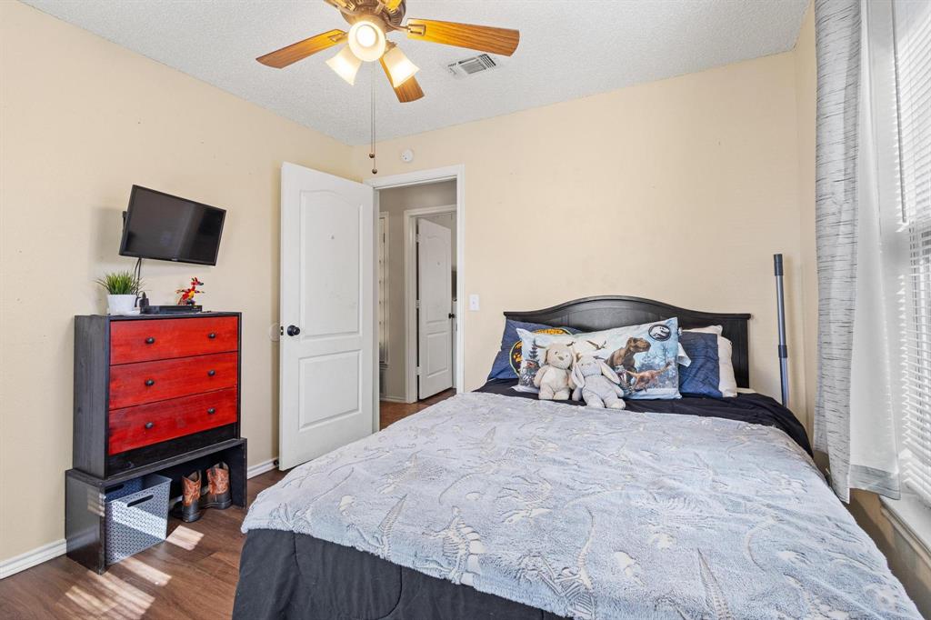 625 County Road Paris, TX 75462 - Photo 14 of 31 a bedroom with a bed and a flat screen tv