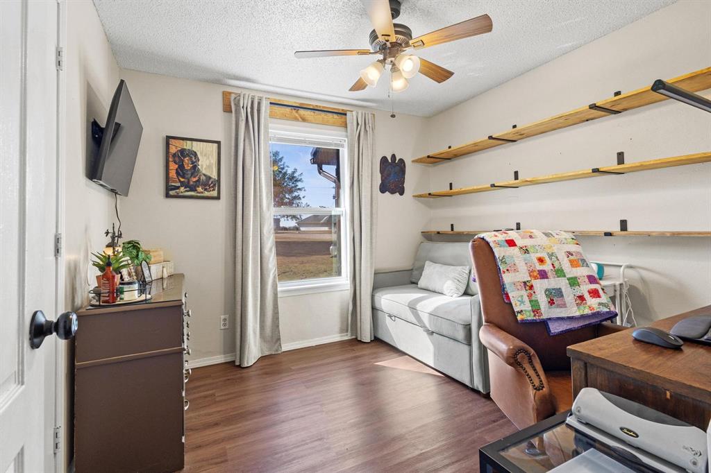 625 County Road Paris, TX 75462 - Photo 20 of 31 a living room with furniture and a flat screen tv