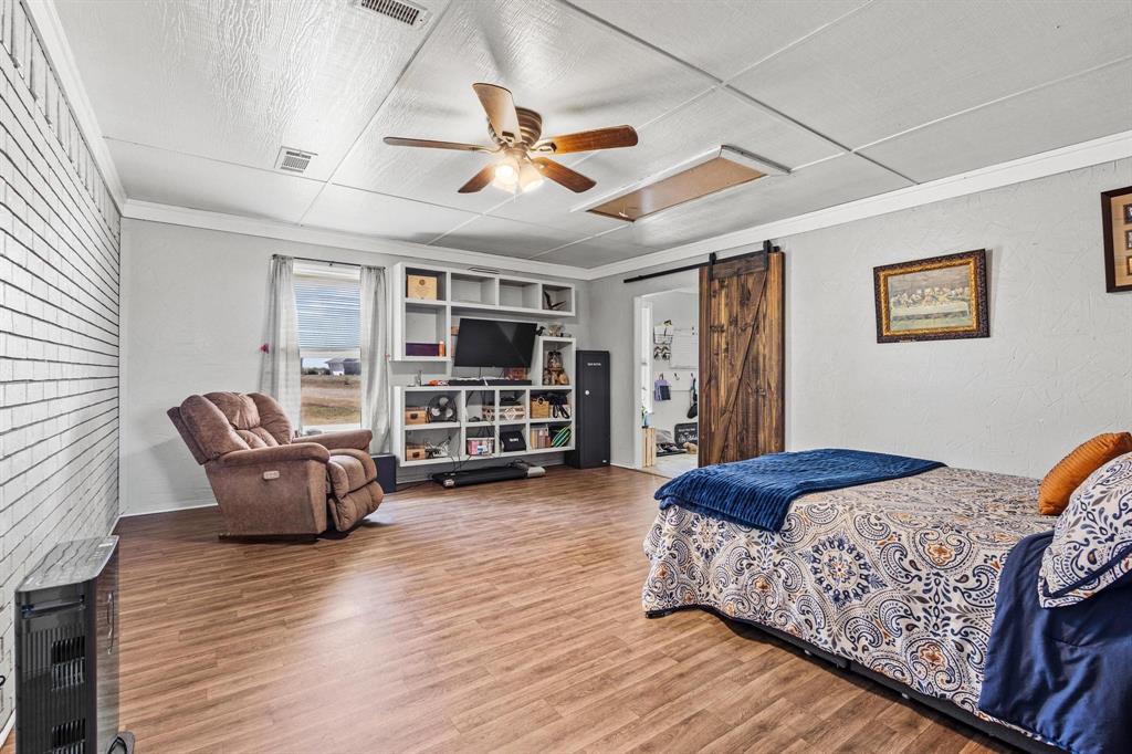 625 County Road Paris, TX 75462 - Photo 21 of 31 a spacious bedroom with a bed and furniture