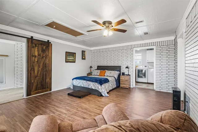 a spacious bedroom with a bed and furniture