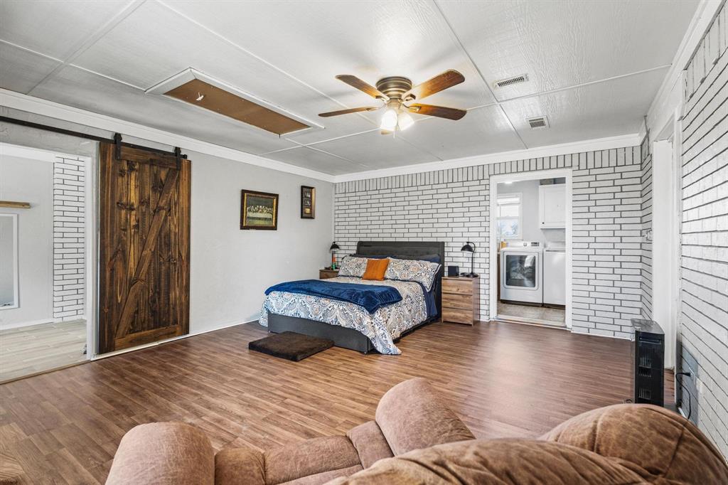 625 County Road Paris, TX 75462 - Photo 22 of 31 a bedroom with a large bed and a window