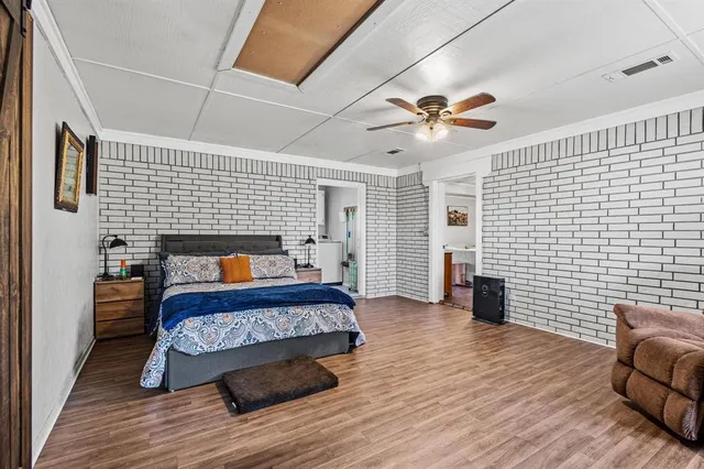 a bedroom with a large bed and a window