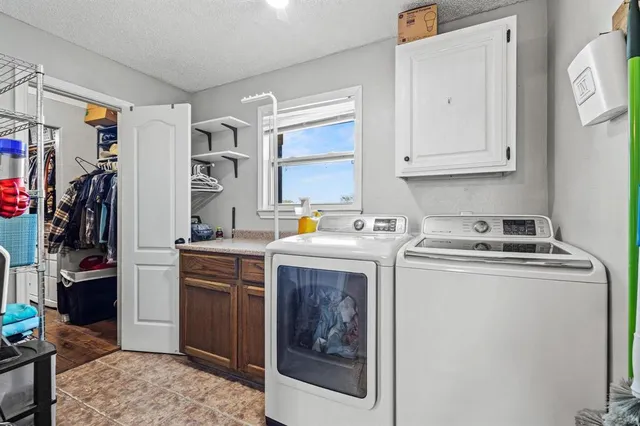 a bedroom with furniture and a fireplace