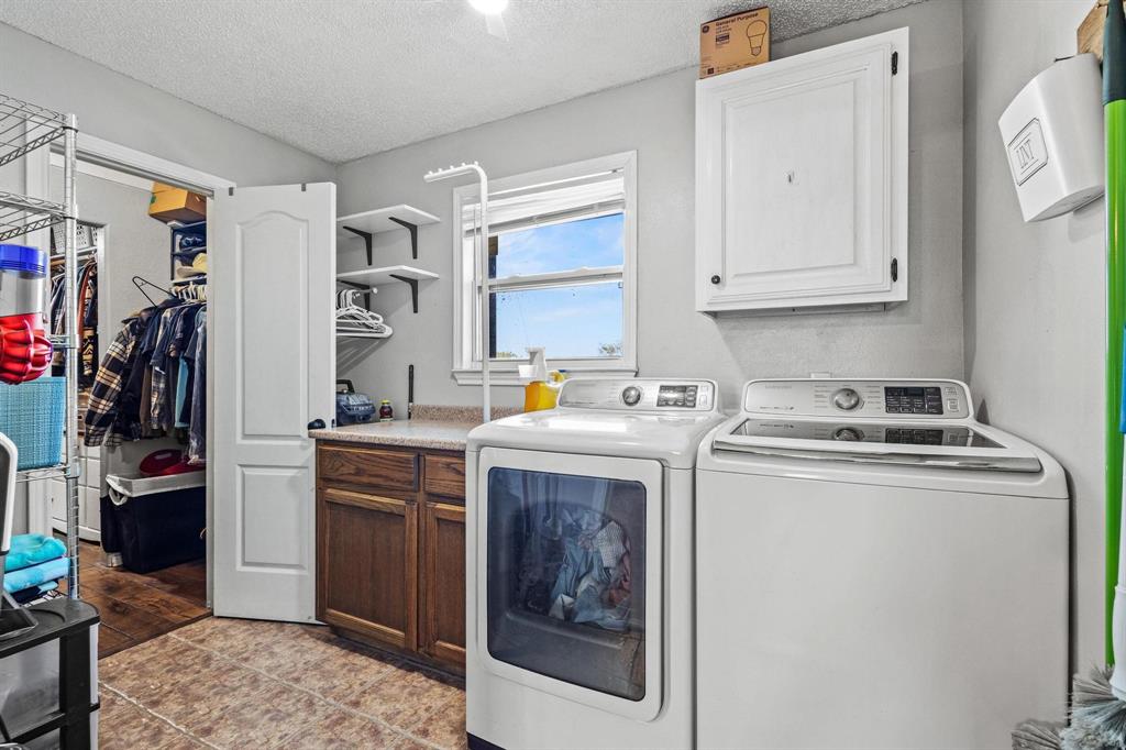625 County Road Paris, TX 75462 - Photo 24 of 31 a utility room with closet dryer and washer