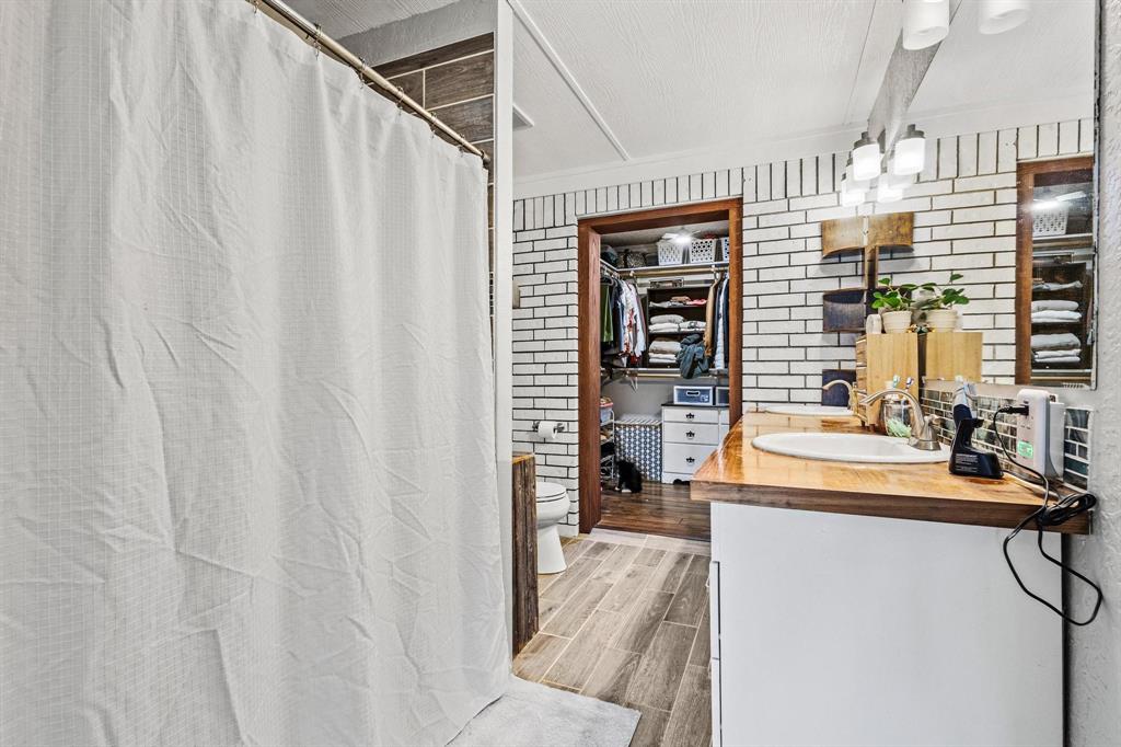 625 County Road Paris, TX 75462 - Photo 26 of 31 a kitchen with a sink and cabinets