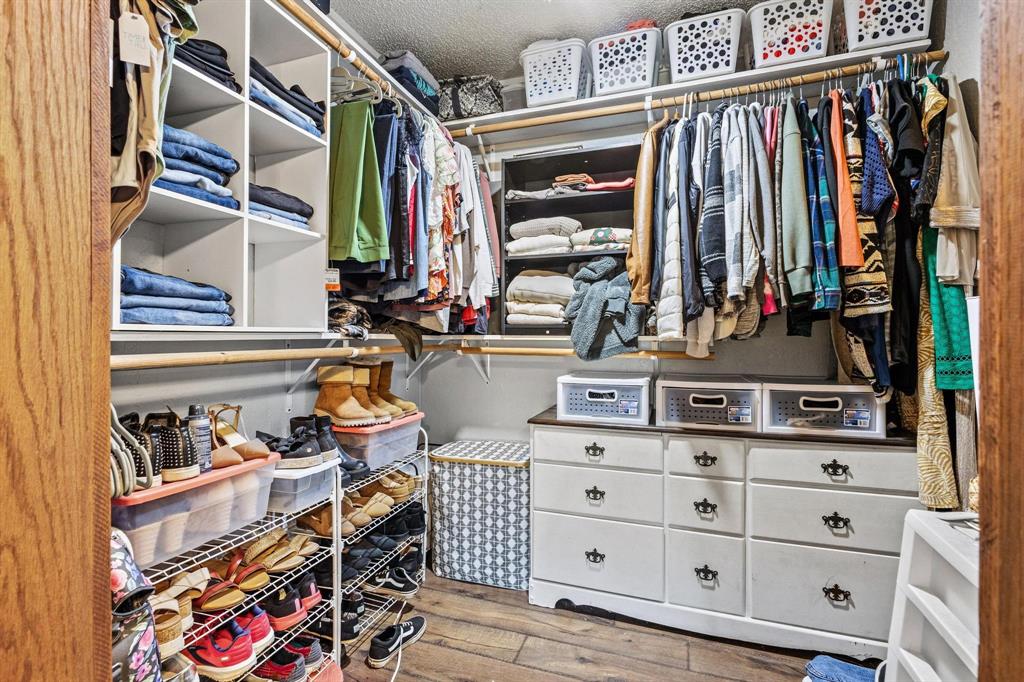 625 County Road Paris, TX 75462 - Photo 27 of 31 a view of walk in closet with clothes and shoes