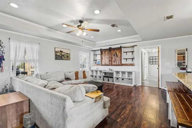 a kitchen with stainless steel appliances granite countertop sink stove microwave and cabinets