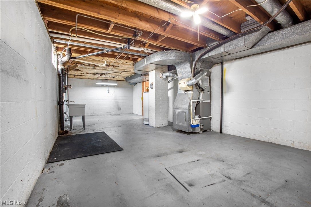 1590 Norledge Road Akron, OH 44305 - Photo 21 of 21 Basement featuring sink and heating utilities