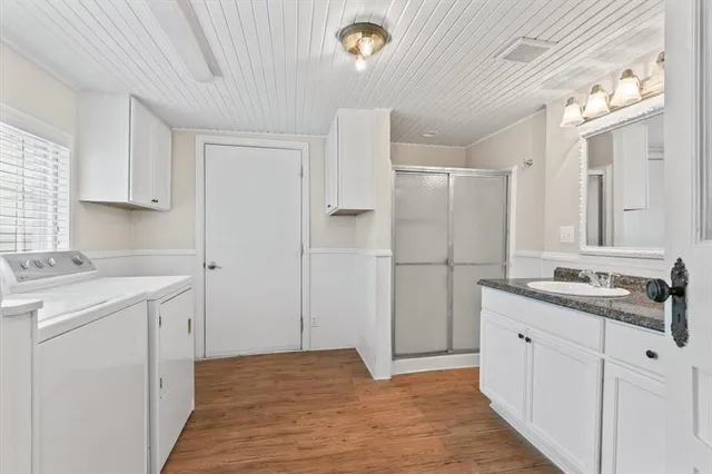 a kitchen with a sink and refrigerator