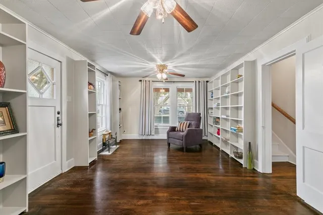 a living room with furniture window and wooden floor