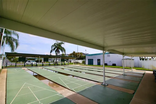 a swimming pool with outdoor seating