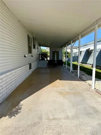a view of a livingroom with furniture and an empty room
