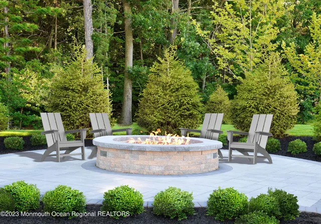 a white bench sitting in the middle of a garden