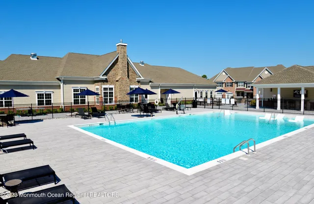 a view of pool with outdoor seating