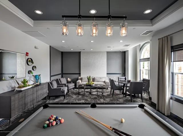 a living room with furniture and tables