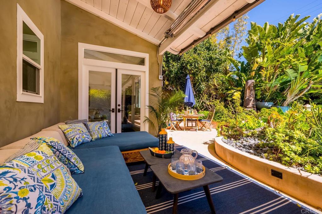 647 Arden Drive Encinitas, CA 92024 - Photo 13 of 36 a view of a dining room with furniture and a potted plant