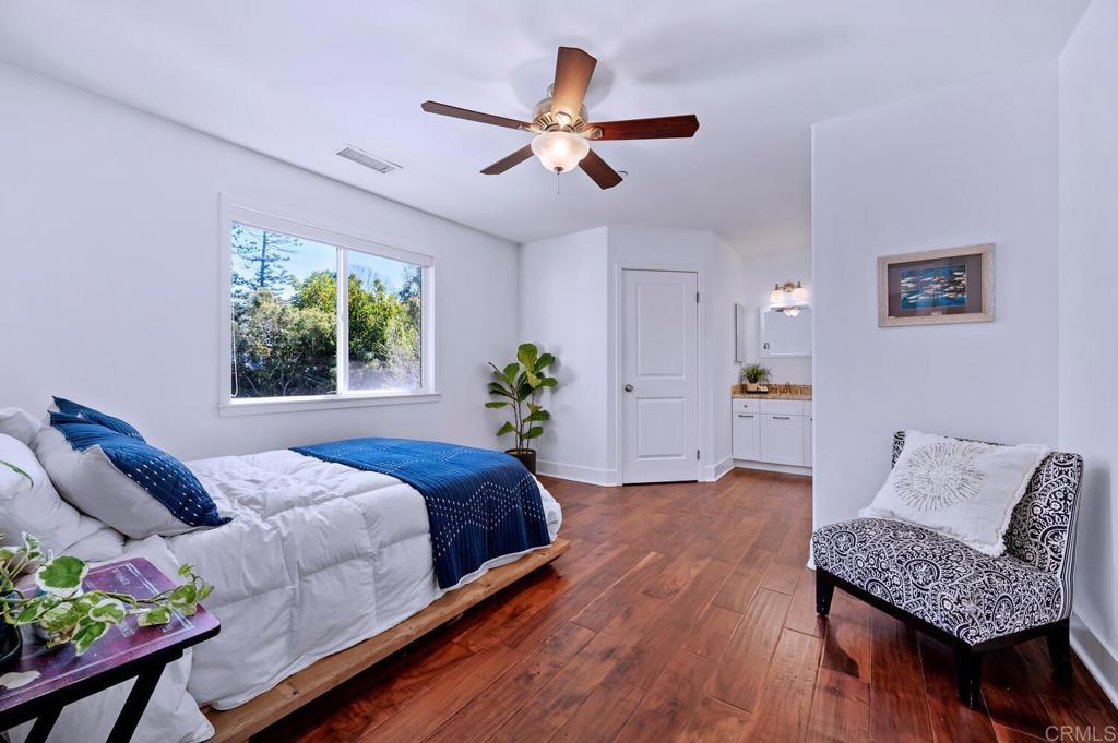647 Arden Drive Encinitas, CA 92024 - Photo 25 of 36 a bedroom with a bed window and couch