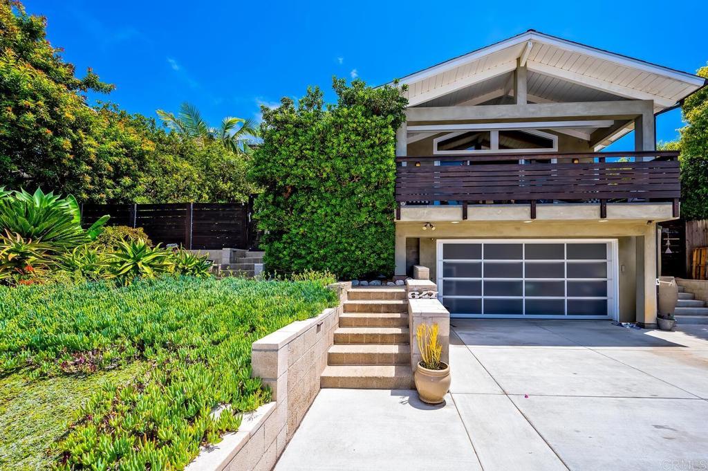 647 Arden Drive Encinitas, CA 92024 - Photo 32 of 36 a front view of a house with a garden