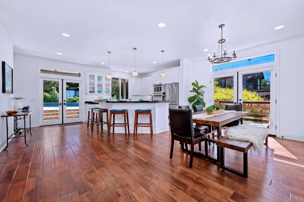 647 Arden Drive Encinitas, CA 92024 - Photo 4 of 36 a view of a dining room with furniture and wooden floor