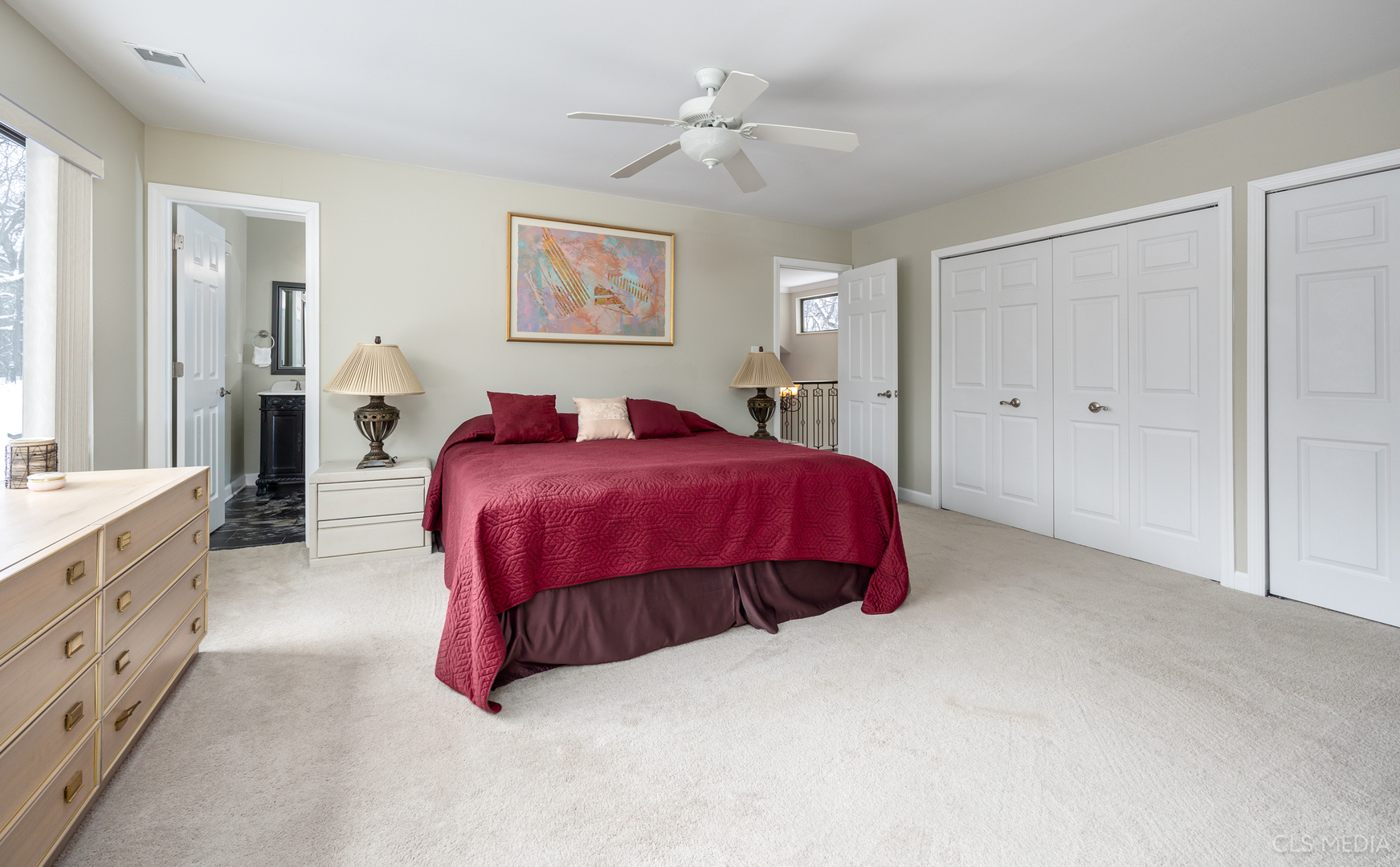 739 Old Barn Road Lake Barrington, IL 60010 - Photo 18 of 37 a spacious bedroom with a bed and a chandelier