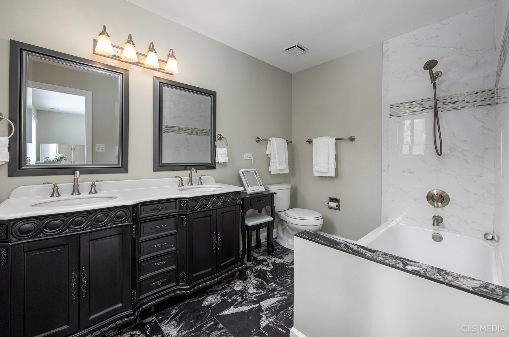 739 Old Barn Road Lake Barrington, IL 60010 - Photo 19 of 37 a spacious bathroom with a double vanity sink a mirror and a bathtub