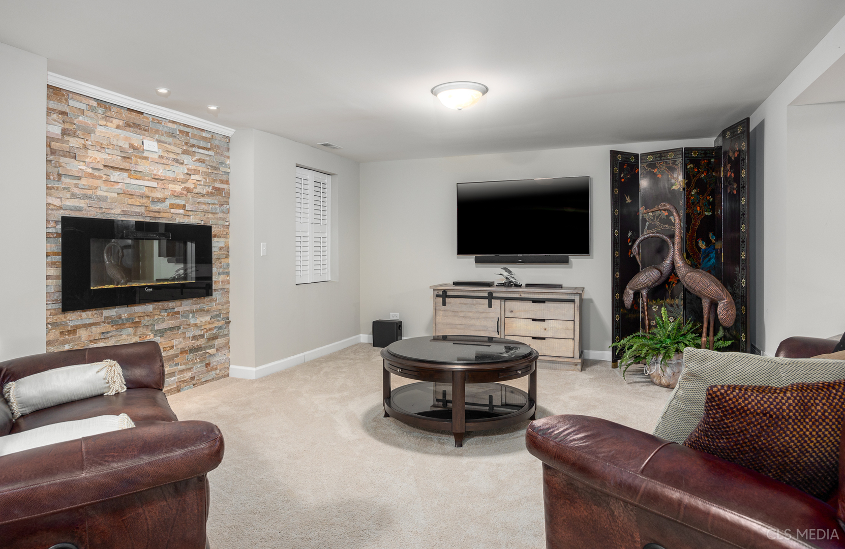 739 Old Barn Road Lake Barrington, IL 60010 - Photo 24 of 37 a living room with furniture and a flat screen tv