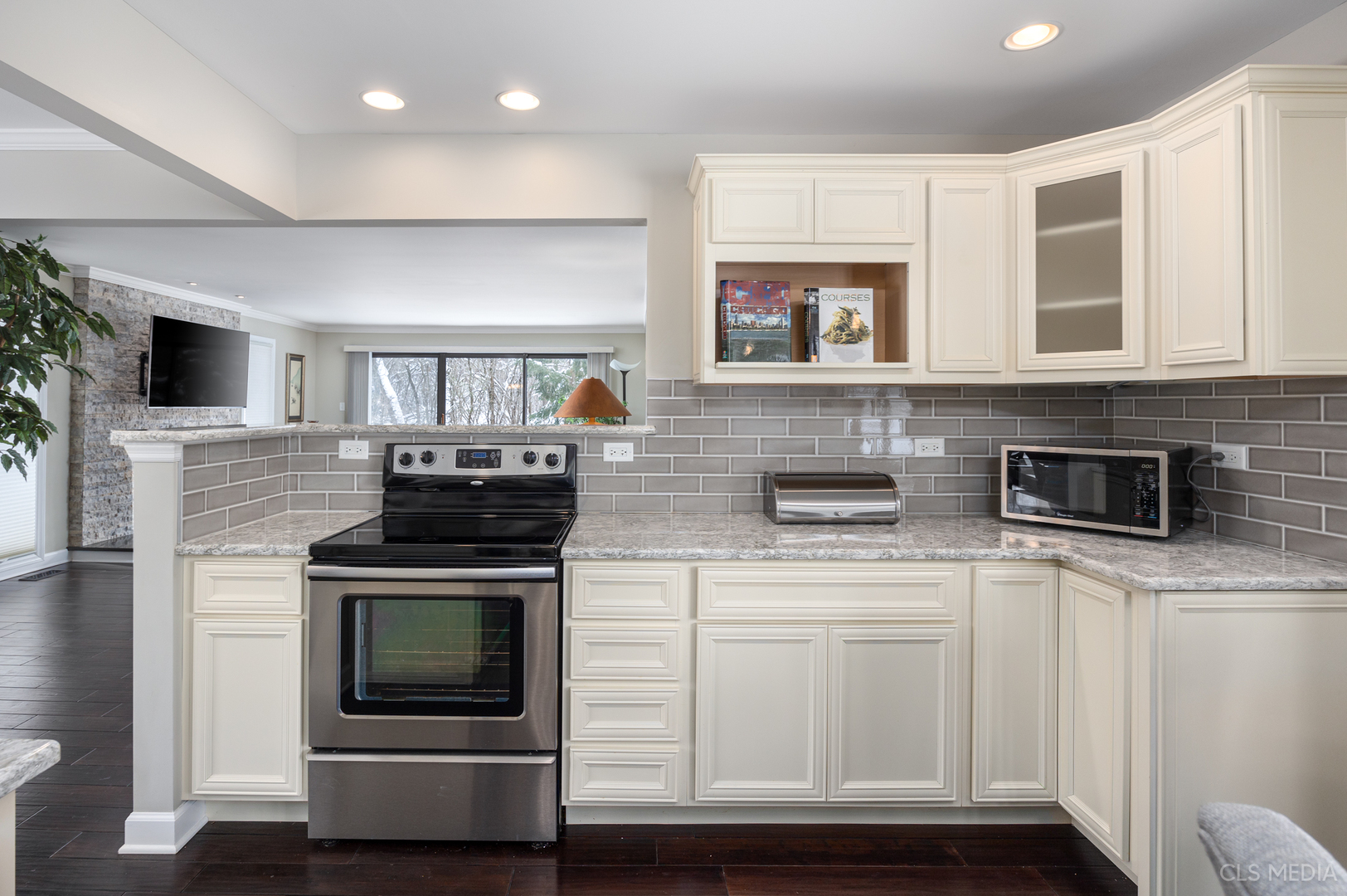 739 Old Barn Road Lake Barrington, IL 60010 - Photo 9 of 37 a kitchen with stainless steel appliances granite countertop a stove and a microwave